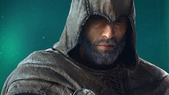 Opisujemy: na zdjęciu znajduje się asasyn Basim z gry Assasin's Creed: Valhalla. Ubrany jest w skórzany strój z kapturem i patrzy w stronę ekranu zamyślonym wzrokiem.